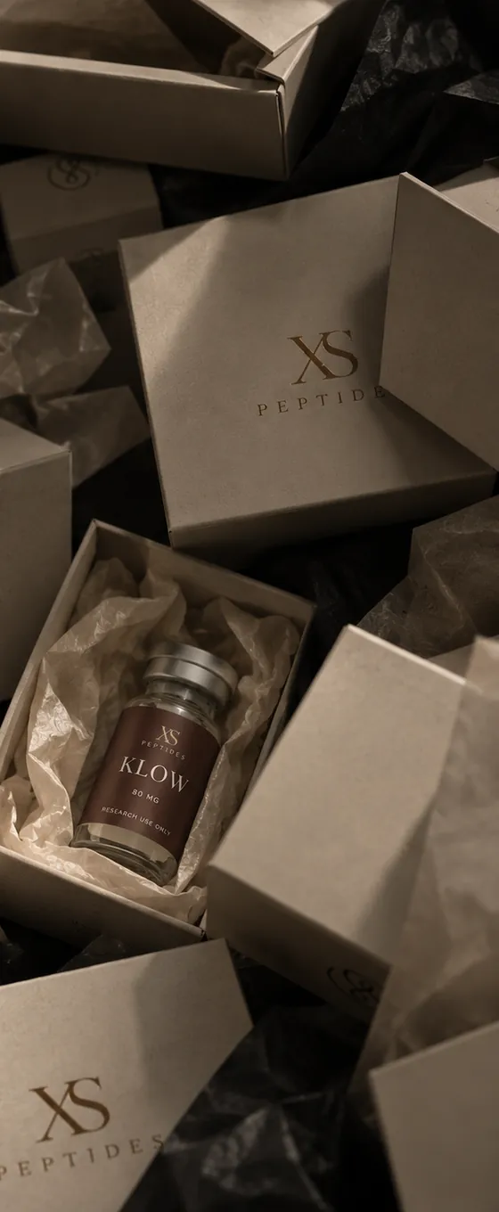 XS boxes packed by hand, a vial resting in tissue